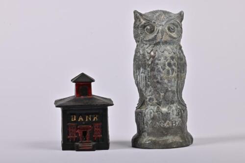 MONEY BOXES: Two 1920/30s American money boxes, a Cupola Bank cast iron money box by J&E Stevens, 9cm high and a Manhattan Savings Bank owl form cast alloy money box, 16cm high