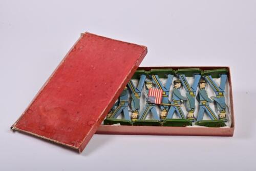 TOY SOLDIERS: An early 20th century American 'Commander Soldier Set' of 9 wooden toy soldiers, from the Commander Toy Selling Co Inc, NYC, in original box