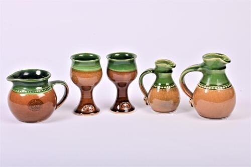 BENDIGO POTTERY: A set of late 20th century Bendigo pottery, comprising three ewers and two goblets, the tallest 14cm high