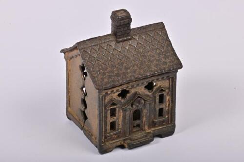 MONEY BOX: An American gilt painted cast iron Quatrefoil House money box made by Stevens/Wing/Arcade between 1902-1926, 10cm high
