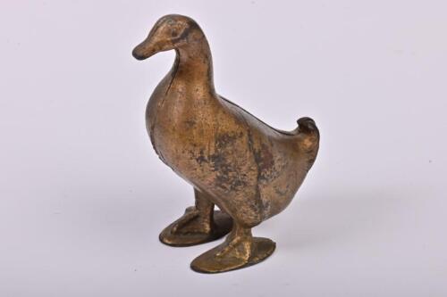 MONEY BOX: An American bronze painted cast iron duck form money box made by AC Williams between 1909-1935, 12.5cm high