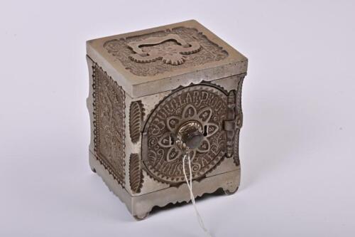 MONEY BOX: A 1902 American cast iron Burglar Proof House Safe money box made by J&E Stevens, with original key and combination, 15cm high