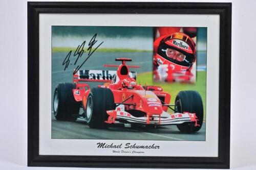 MICHAEL SCHUMACHER: A framed commemorative poster 'World Drivers Champion' featuring Michael SCHUMACHER, framed and glazed, 46 x 56cm