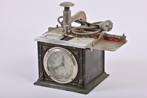 CLOCK IN MACHINE: A National Time Recorder Co Ltd clock in machine, not recently serviced or timed, not known to be functional, 29cm high, 30cm wide, 19cm deep