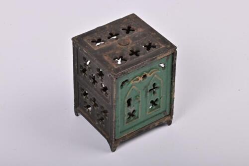 MONEY BOX: A 1890s American cast iron ecclesiastical money box made by Shimer, 8cm high