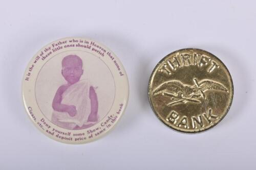 MONEY BOXES: Two small American 1920/30s money boxes, a tin Thrift Bank money box, 4cm diameter, and a Society of St Peter money bank, 5.5cm diameter