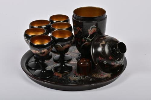COCKTAIL SET: A 1920s Chinese lacquerware Ling Dai Mi dragon decorated cocktail set, comprising a cocktail shaker, tray and six 'glasses', the shaker 22cm high