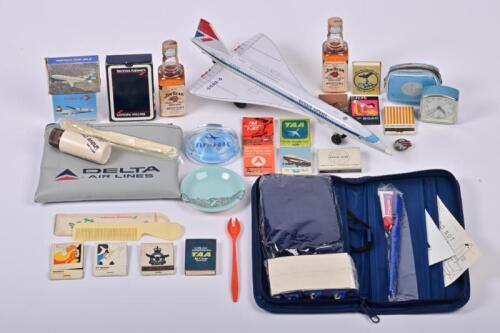 VINTAGE AVIATION: A collection of vintage commercial aviation merchandise and complimentary items, including a model of the Concorde, a Pam Am alarm clock in miniature flight bag, matches, playing card etc., the Concorde 33cm long