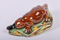 ROSEDALE: A circa 1958 New South Wales Rosedale Pottery slip cast figure of a platypus, bears label to side and stamped to base: Modelled by Rosedale, 14 cm wide - 2