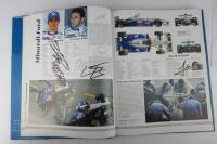 FORMULA 1: 1998/99 F1 Yearbook with multiple F1 signtures including Brawn, Schumacher, Todt. - 4