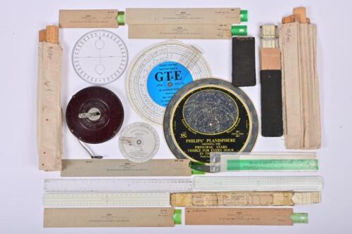 MEASURING: A collection of vintage rulers, slide ruler and measuring tape