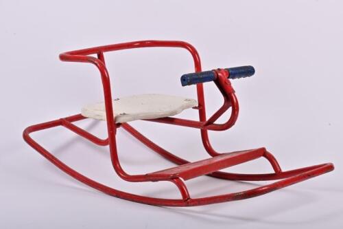 CYCLOPS ROCKER: A circa 1950s Cyclops red painted wrought iron children's rocker, in good original condition, 31cm high, 77cm long, 30cm deep