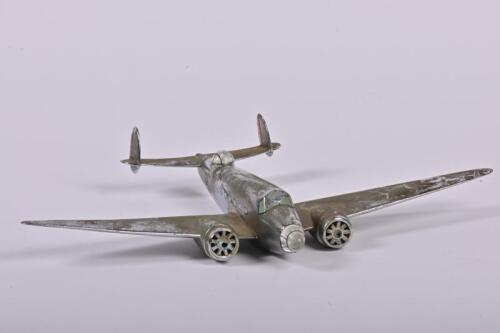 LOCKHEED: A mid-20th century cast chromed brass model of a Lockheed Hudson MKI patrol bomber, 20cm long, 31cm across the wingspan