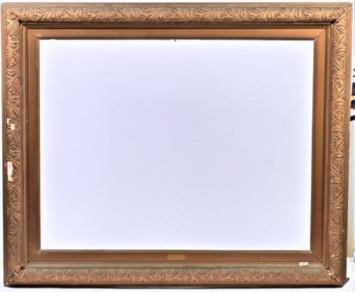 DECORATIVE FRAME: A large late Victorian aesthetic movement giltwood and gesso frame