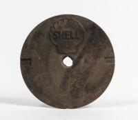 SHELL: A cast iron service station underground tank filler cover plate with SHELL lettering inside Shell Clam, 27cm diameter. Good Original condition.