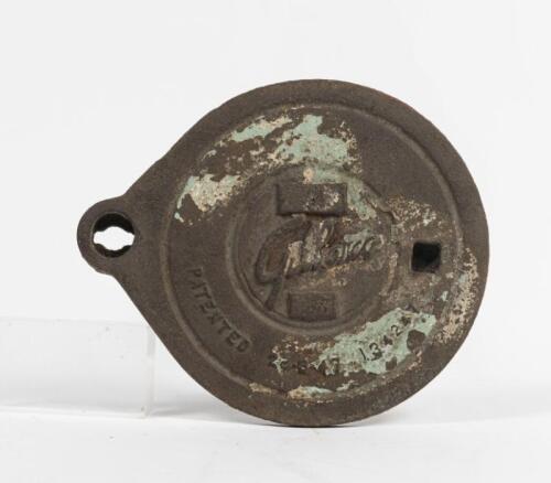 GILBARCO: A cast iron service station underground tank filler cover plate, Gilbarco script lettering, 19.5cm diameter. Original condition.