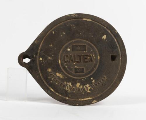 CALTEX: A cast iron service station underground tank filler cover plate with CALTEX lettering, 26cm high x 30cm wide. Good Original condition.