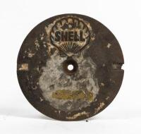 SHELL: A cast iron service station underground tank filler cover plate, Shell Clam with lettering inside shell, 27cm diameter. Original condition