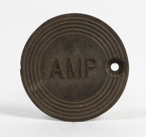 AMP: c1936-1949 cast iron service station underground tank filler cover plate with AMP lettering, 23cm diameter. Original condition. Remnants of blue paint evident