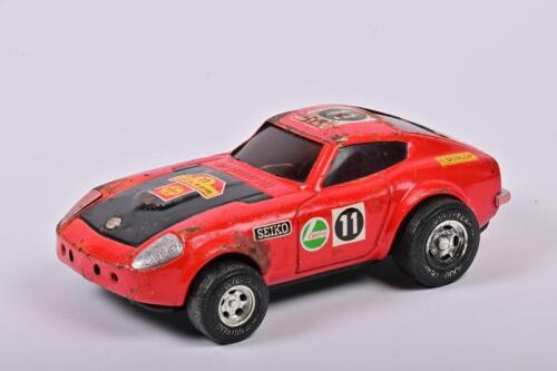 DATSUN 240Z: A circa 1971 tin model of the Datsun team 'East African Safari Rally' winning car from 1971, 23cm wide