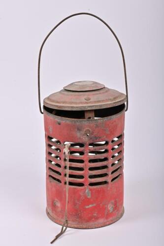 ROAD LAMP: A circa 1950/60s Appletons cylindrical red enamel hand-held road lantern, interior contains a flat wick kerosene burner missing glass chimney, 26cm high