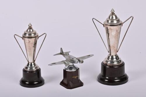 TROPHIES: Three circa 1960s trophies, two silver plate and one cast aluminium in the form of an aeroplane, the tallest 23cm high