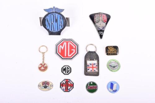 BRITISH BADGES: A collection of British badges. MG, Rover, Triumph badges