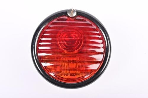 BRAKE LIGHT: A brand new pork-pie Lucas emblemed tail lamp, indicator and number plate illumination lamp