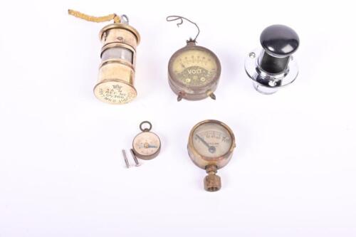 VINTAGE SUNDRY PARTS: A group of vintage sundry parts. Ashtray, dashboard lamp, volt meter, brass pressure gauge and compass
