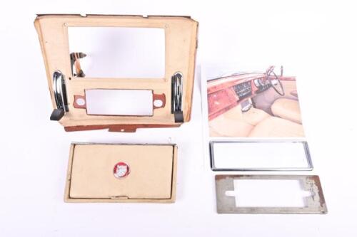 JAGUAR: A Jaguar MK II centre console with radio surround and radio holder bracket. Leather ashtray cover
