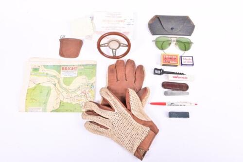 CLASSIC GLOVEBOX: An eclectic mix of glovebox items. Drivers gloves and glasses