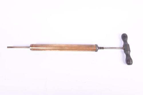 OIL PUMP: A vintage brass oil pump with wooden handle