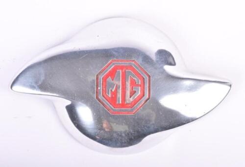 M.G: An M.G pre-war spare wheel embellisher/finisher