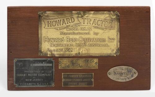 BODY PLATES: A collection of body plates on wooden board. 'HOWARD TRACTOR', 'DURANT MOTOR COMPANY', 'SINGER & CO Ltd - COVENTRY' body plates