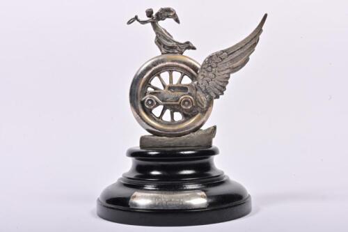 RACV: An impressive winged wheel trophy with mounted inscription plaque reading "R.A.C.V 24 HOURS TRIAL, MELBOURNE TO SYDNEY 1929, 1ST CLASS AWARD, A.E. BEDFORD", the trophy cast in brass and nickel plated, mounted to original ebonised circular base, 31cm
