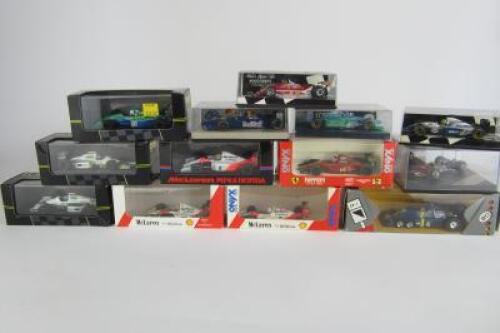 F1 MODELS: A group of boxed F1 1:43 scale models.