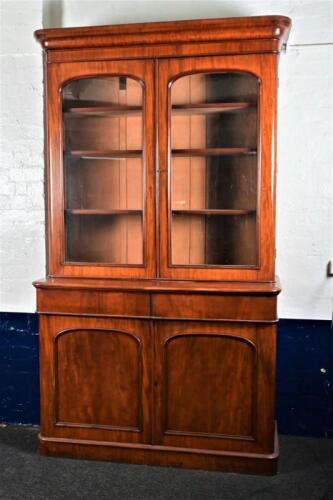 BOOKCASE: A Victorian Australian cedar glazed bookcase, 240cm high, 137cm wide, 51cm deep