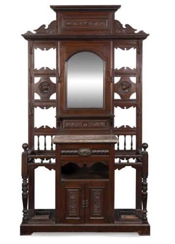 HALL STAND: An Edwardian carved mahogany hall stand, with cast iron hooks and central marble top, 223cm high, 131cm wide, 39cm deep