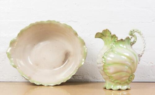 WASH BASIN AND JUG: A Victorian opalescent glaze gilt rim wash basin and jug, the jug 32cm high