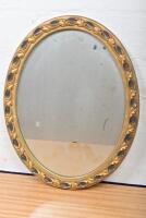 MIRROR: A small oval giltwood mirror, 38.5 x 30cm