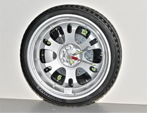 CLOCK: A novelty Sempre battery wheel form clock, 25cm diameter, working order