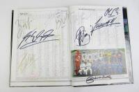 FORMULA 1: 'Formula One Yearbook 1997-98' hardcover book with multiple F1 driver signatures. Includes Alesi, Irvine, Schumacher signatures. - 2