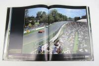 FORMULA 1: 'Formula One Yearbook 1997-98' hardcover book with multiple F1 driver signatures. Includes Alesi, Irvine, Schumacher signatures. - 3
