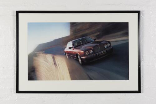BENTLEY: A showroom photographic print of the Bentley R Continental, mounted framed and glazed, 68cm high x 102cm wide overall