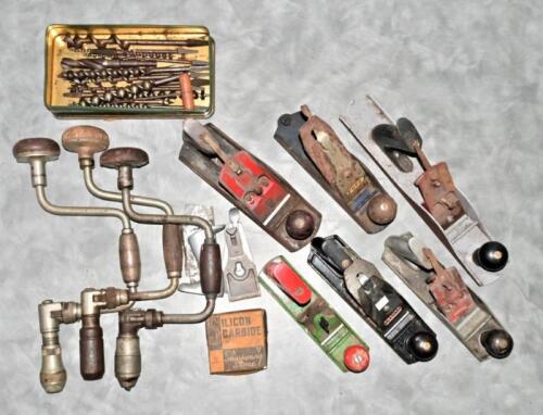 TOOLS: A collection of early hand tools including hand drills, with bits and wood planes