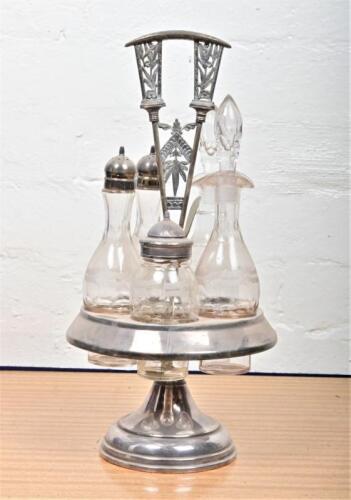 CRUET: An antique silver plate and etched glass cruet set, 38cm high