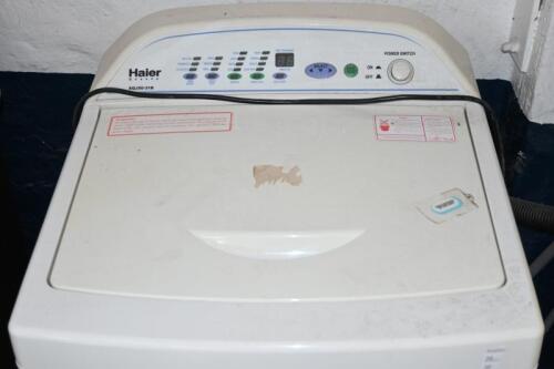 WASHING MACHINE: A Haier XQJ50-31B top loading washing machine, 93cm high, 54cm wide, 56cm deep