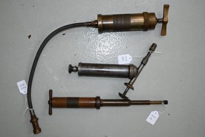 GREASE GUNS: Including two Enols branded in brass and another in silver cast 'S.T.G Sydney'