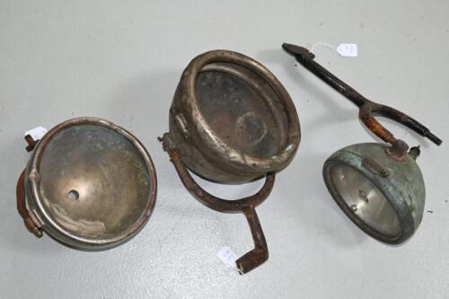CAV: Three early C.A. VANDERVELL headlights in brass and nickel plate, all in various conditions as photographed, flat glass of one being 17 cm diameter, one with glass stamped to hinge 'H', this bracket to large for lamp.