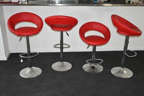 STOOLS: Four read hydraulic adjustable red vinyl and chrome bar stools, one hydraulic of a seat not locking up at extending position.&nbsp;&nbsp;